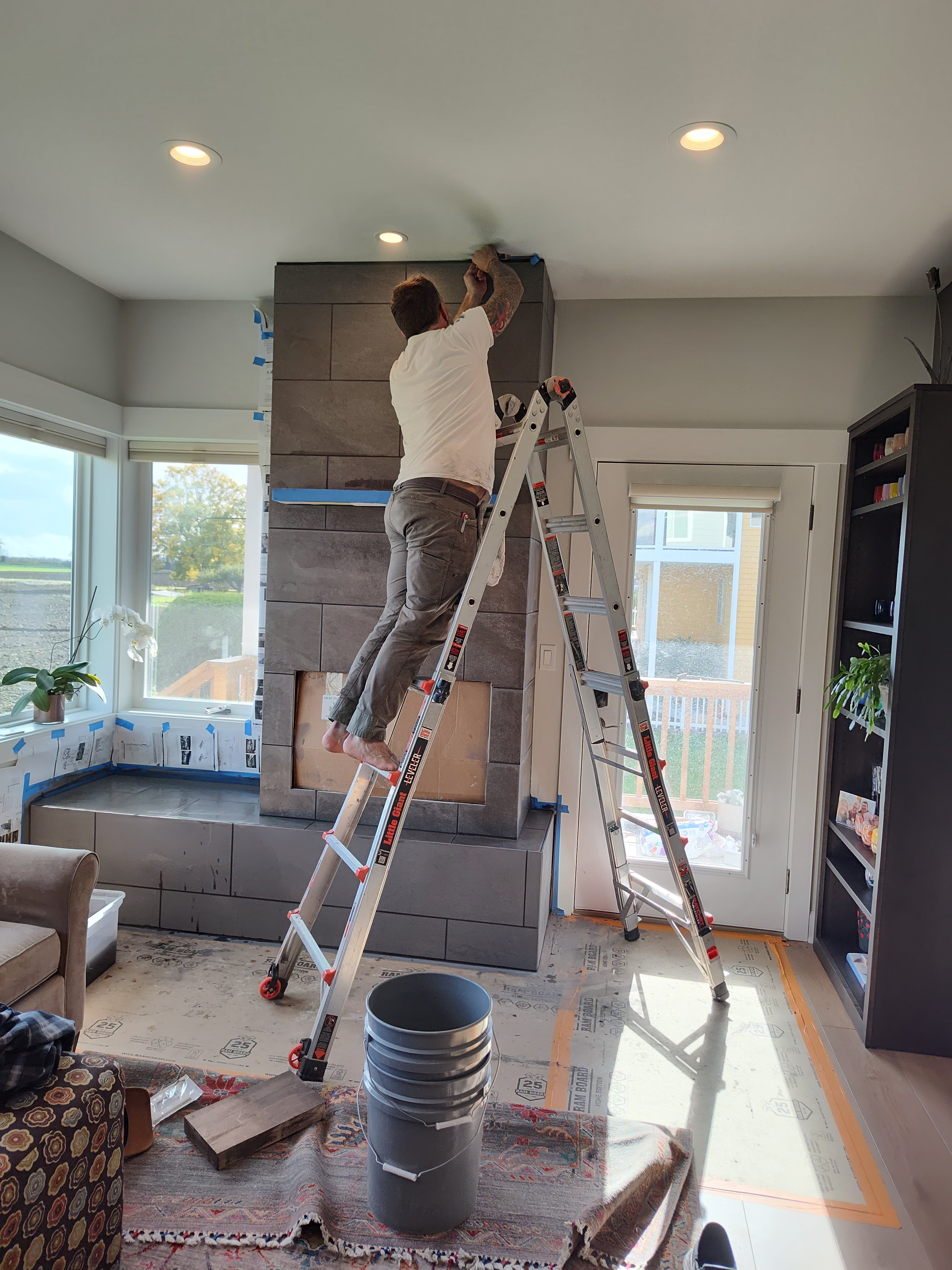 Tile, framing and fireplace w mantel installation