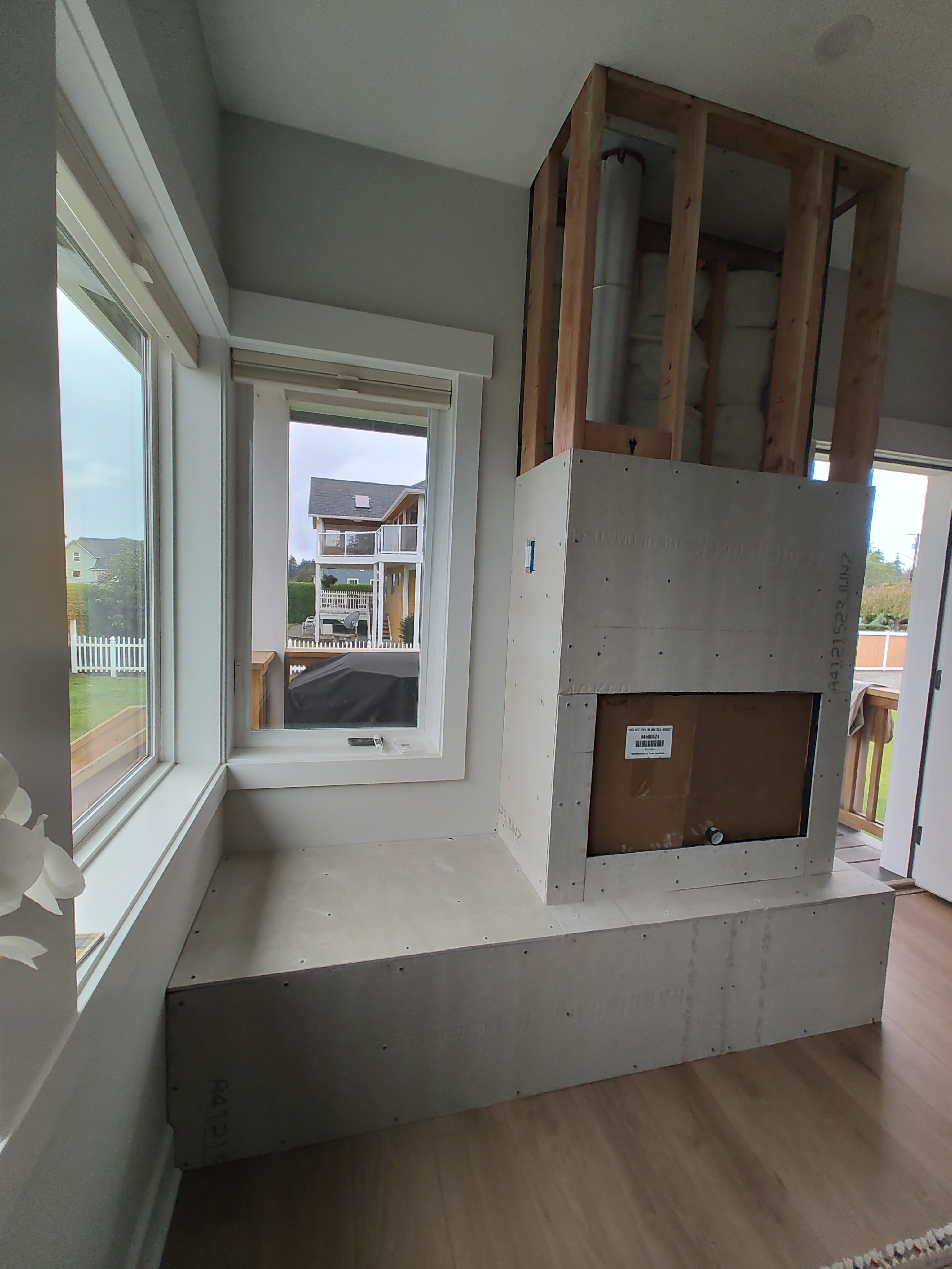 Tile, framing and fireplace w mantel installation