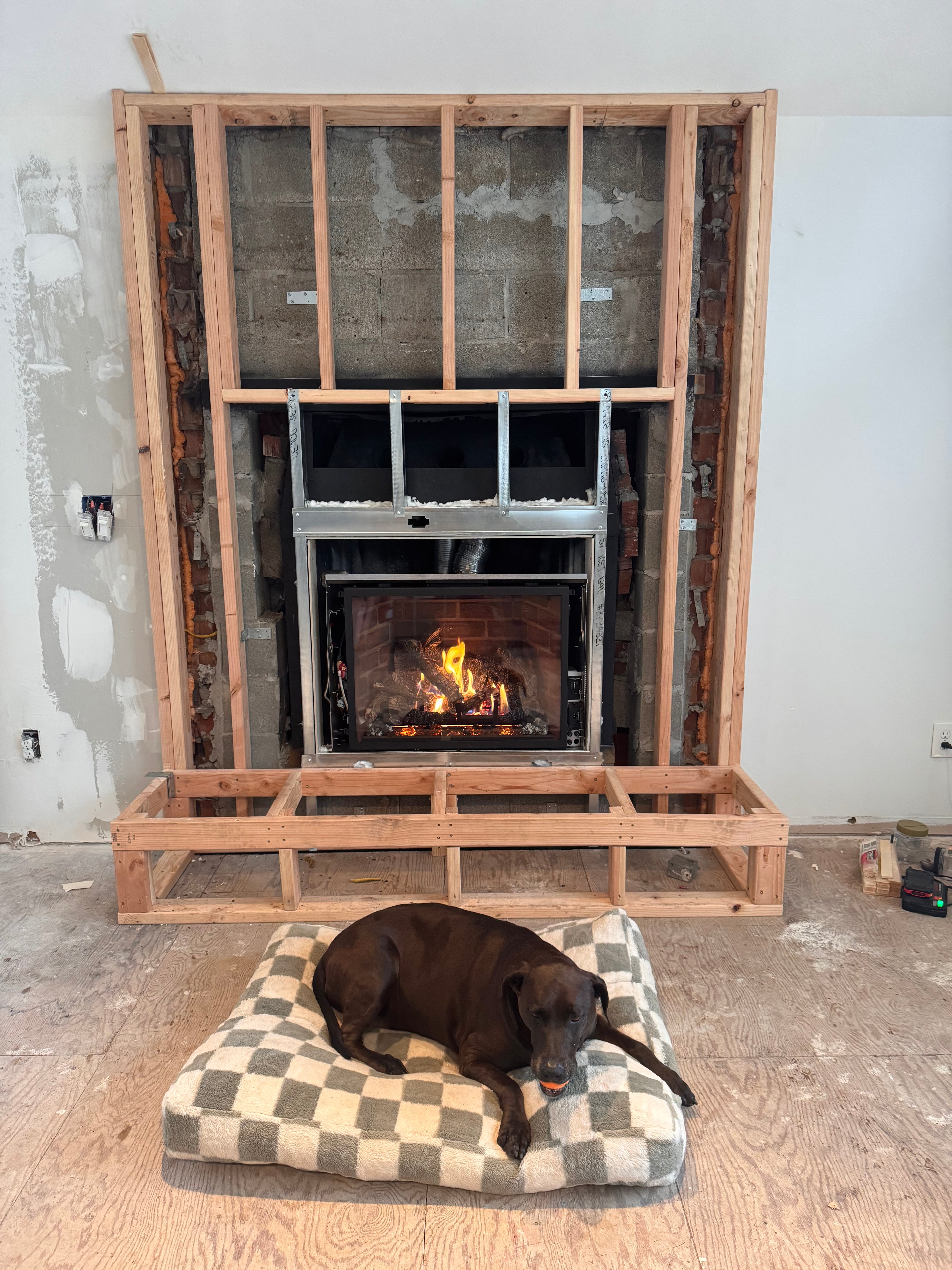 Custom Installtion with stacked Stone, framing and mantel