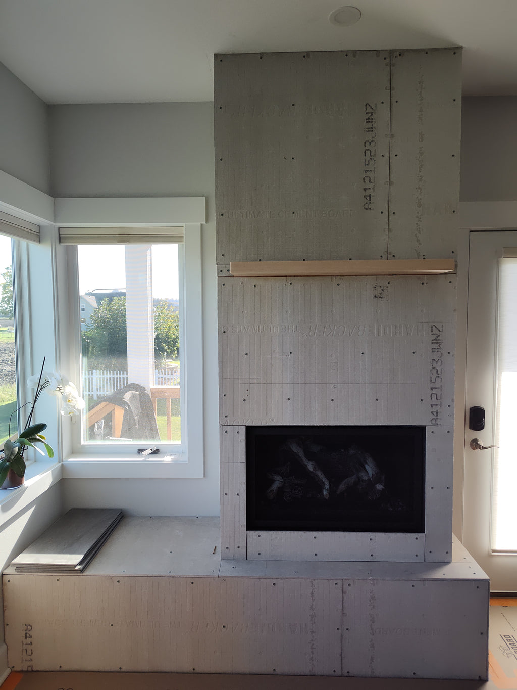 Tile, framing and fireplace w mantel installation